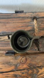 Oliva Stoneware Mug Lighter than it looks. richer than it feels A glossy olive-toned stoneware mug with subtle yellow-green speckles and a flat handle, carrying a fresh, natural energy in every sip.