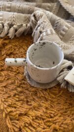 Sylva Stoneware Mug Familiar nature… seen in a deeper shade A creamy beige stoneware mug with soft olive speckles, inspired by traditional coffee rituals and quiet everyday moments.