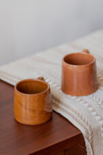 Glazed handmade ceramic mug in earthy tones
