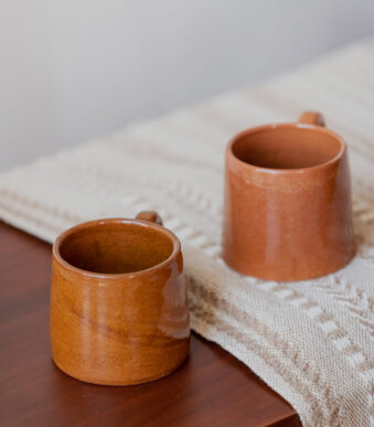 Glazed handmade ceramic mug in earthy tones