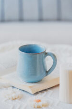 Glazed handmade ceramic mug in earthy tones