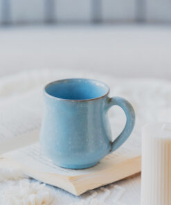 Glazed handmade ceramic mug in earthy tones