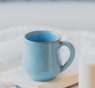 Glazed handmade ceramic mug in earthy tones