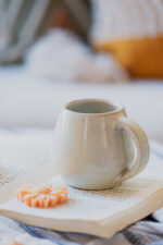 Glazed handmade ceramic mug in earthy tones