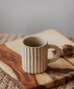 Glazed handmade ceramic mug in earthy tones