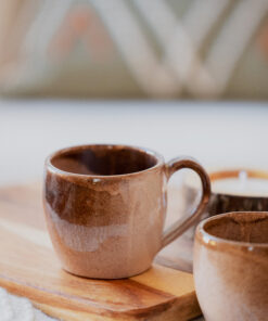 Glazed handmade ceramic mug in earthy tones