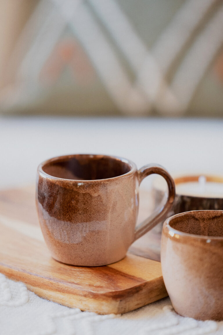 Glazed handmade ceramic mug in earthy tones