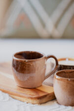 Glazed handmade ceramic mug in earthy tones