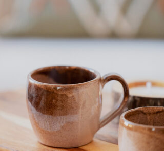 Glazed handmade ceramic mug in earthy tones