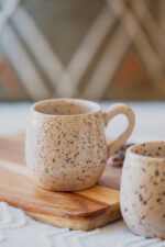 Glazed handmade ceramic mug in earthy tones