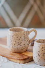Glazed handmade ceramic mug in earthy tones