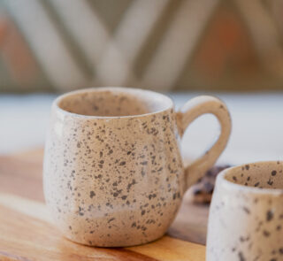 Glazed handmade ceramic mug in earthy tones
