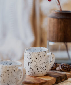 Glazed handmade ceramic mug in earthy tones