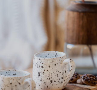 Glazed handmade ceramic mug in earthy tones