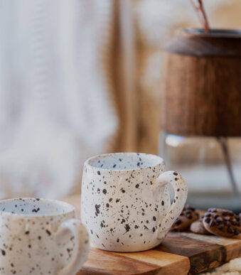 Glazed handmade ceramic mug in earthy tones