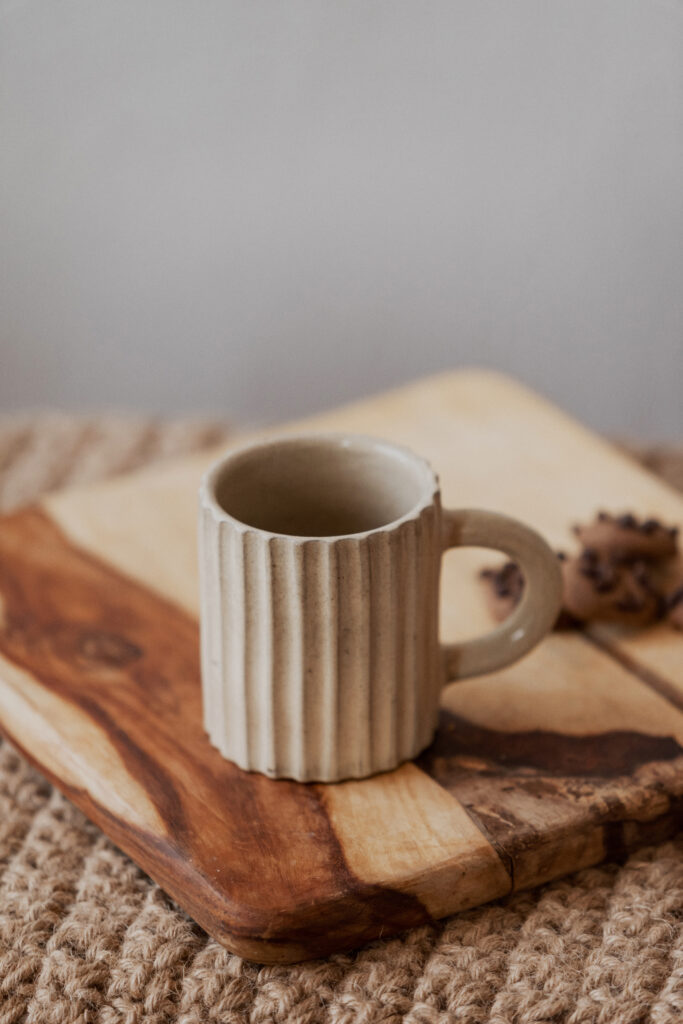 Glazed handmade ceramic mug in earthy tones