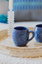 Glazed handmade ceramic mug in earthy tones