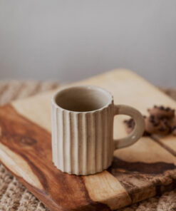 Glazed handmade ceramic mug in earthy tones