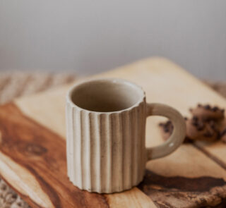 Glazed handmade ceramic mug in earthy tones
