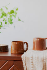 Glazed handmade ceramic mug in earthy tones