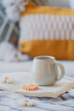 Glazed handmade ceramic mug in earthy tones