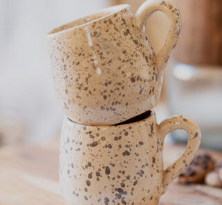 Glazed handmade ceramic mug in earthy tones