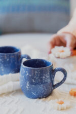 Glazed handmade ceramic mug in earthy tones