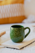 Glazed handmade ceramic mug in earthy tones