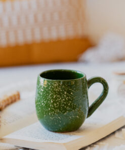 Glazed handmade ceramic mug in earthy tones