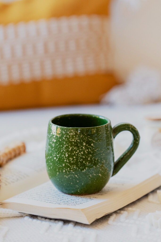 Glazed handmade ceramic mug in earthy tones
