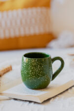Glazed handmade ceramic mug in earthy tones