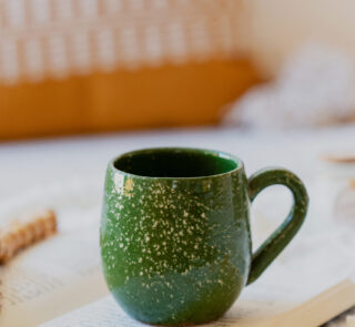 Glazed handmade ceramic mug in earthy tones