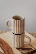 Glazed handmade ceramic mug in earthy tones