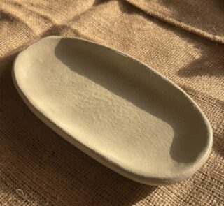 Suna Organic Platter Handcrafted from premium natural stoneware, this Wabi-Sabi platter features a unique sandy texture and organic edges—perfectly sized to serve your finest appetizers or style your favorite home accents.