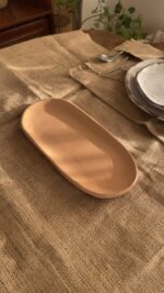 Sora Gathering Platter Handcrafted from premium natural stoneware, this medium Wabi-Sabi platter features a smooth earth-toned finish and organic edges—perfectly sized for serving appetizers, side dishes, or styling your space.
