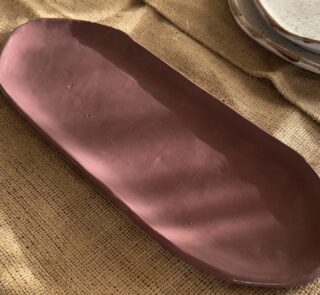 Abyss Hearth Platter Handcrafted from premium natural stoneware, this medium Wabi-Sabi platter features a smooth earth-toned finish and organic edges—perfectly sized for serving appetizers, side dishes, or styling your space.