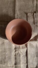 Canyon Serve Bowl A unique stoneware bowl with a beautiful carved design on the outside. It comes in a warm, natural brown clay color. With its deep shape, it is perfect for serving salads, fruits, or hot dishes.