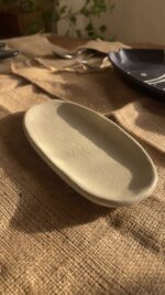 Suna Organic Platter Handcrafted from premium natural stoneware, this Wabi-Sabi platter features a unique sandy texture and organic edges—perfectly sized to serve your finest appetizers or style your favorite home accents.