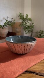 Arc Emerald Bowl Crafted with a textured, crackled exterior and a vibrant emerald green glaze inside, this compact bowl adds a striking touch to your table. It is perfect for individual snacks or dips.
