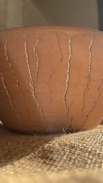 Flugor Pearl Bowl Crafted with a textured, crackled exterior and a vibrant alabaster beige glaze inside, this compact bowl adds a striking touch to your table. It is perfect for individual snacks or dips.