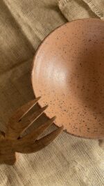 Conical Serve Bowl A large and beautiful stoneware serve bowl with a warm sandy color and natural dark speckles. With its wide shape, it is perfect for serving big family salads, fruits, or main dishes.