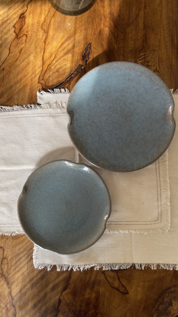 Remnant Dinnerware Plate Inspired by the quiet traces of nature, this organic stoneware plate features unique speckled textures and artfully distorted rims. The calming harmony of sky blue and rock grey makes the Remnant set less of a dinnerware and more of a sculpted art piece for your dining space.