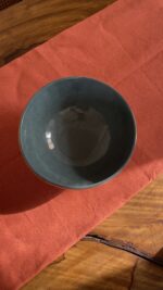 Arc Emerald Bowl Crafted with a textured, crackled exterior and a vibrant emerald green glaze inside, this compact bowl adds a striking touch to your table. It is perfect for individual snacks or dips.
