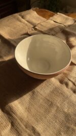 Flugor Pearl Bowl Crafted with a textured, crackled exterior and a vibrant alabaster beige glaze inside, this compact bowl adds a striking touch to your table. It is perfect for individual snacks or dips.