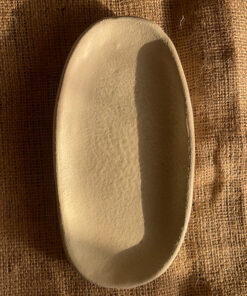 Suna Organic Platter Handcrafted from premium natural stoneware, this Wabi-Sabi platter features a unique sandy texture and organic edges—perfectly sized to serve your finest appetizers or style your favorite home accents.