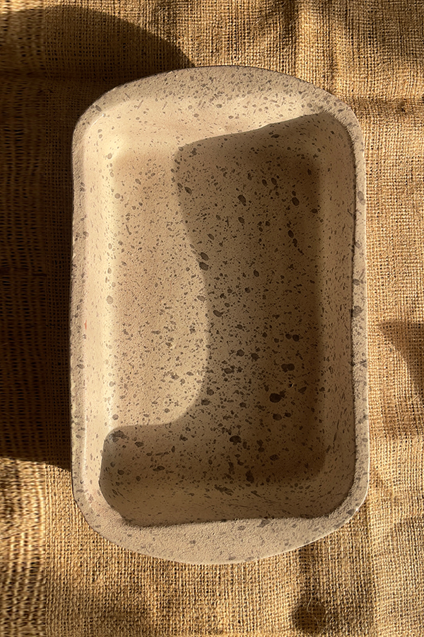 Pebble Oven Dish A beautiful rectangular stoneware dish with a warm sandy color and natural dark speckles. Perfect for both baking in the oven and serving directly on the table. It is great for making family meals, pasta, or roasted dishes.