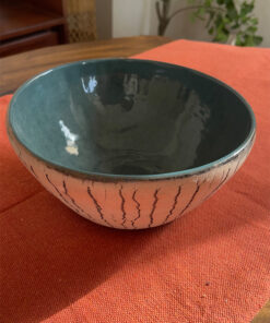 Arc Emerald Bowl Crafted with a textured, crackled exterior and a vibrant emerald green glaze inside, this compact bowl adds a striking touch to your table. It is perfect for individual snacks or dips.