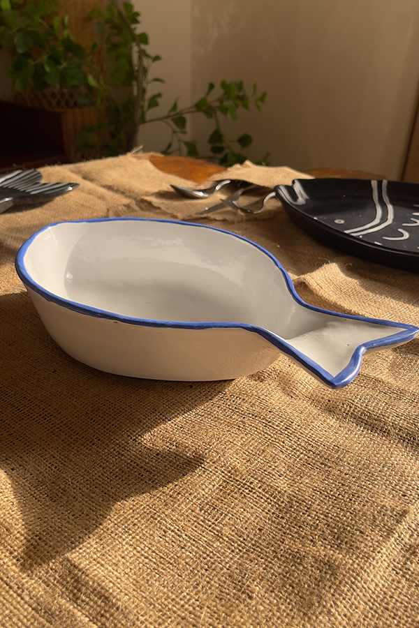 Caspian Fish Bowl Enjoy your seafood in a refreshing, open-air seaside vibe. Featuring a clean white base and a vibrant blue hand-painted rim, this fish-shaped individual bowl is perfect for your personal servings of seafood soup or pasta.